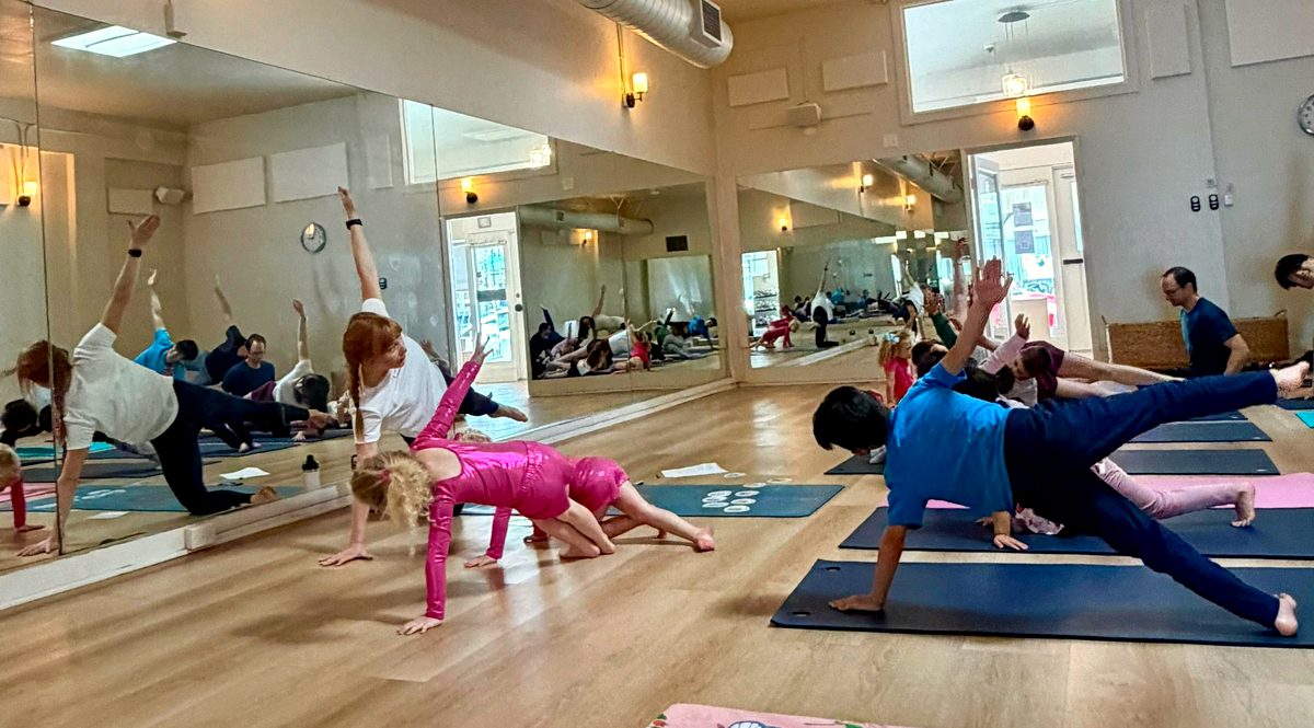 Families doing yoga together