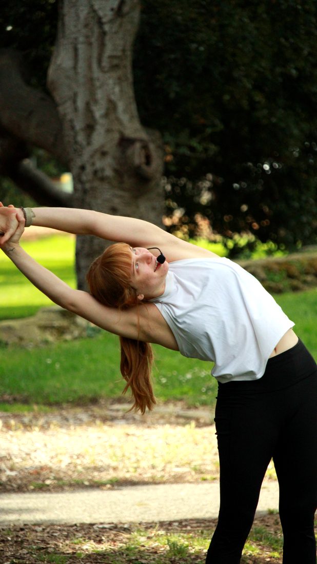 Teacher Lindsay practicing yoga outdoors